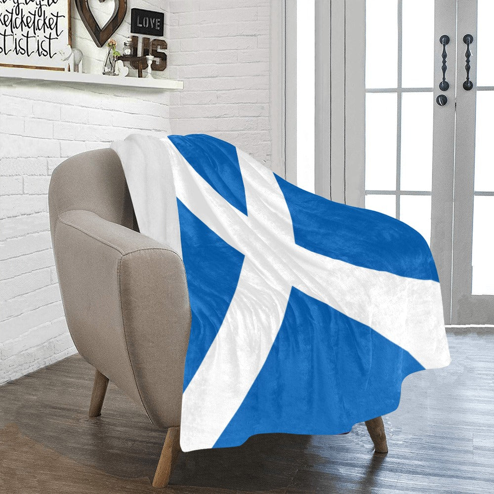 Luv My Flag Scottish throw blanket on cozy beige chair.