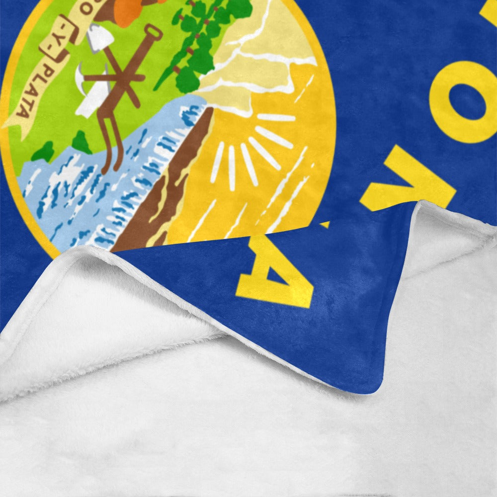"Luv My Flag fleece blanket with colorful emblem design."