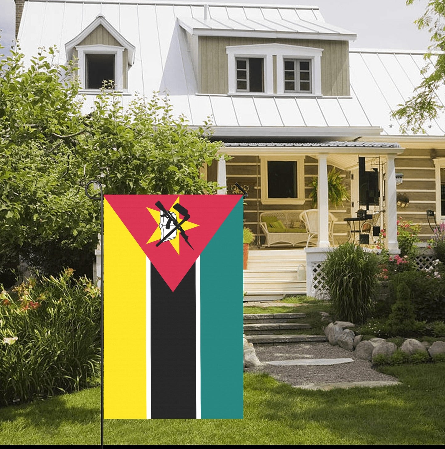 House with Luv My Flag, Mozambique flag displayed outside.