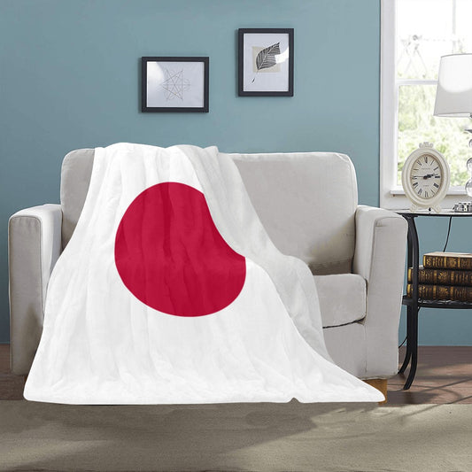 Luv My Flag blanket featuring Japan's flag on couch.