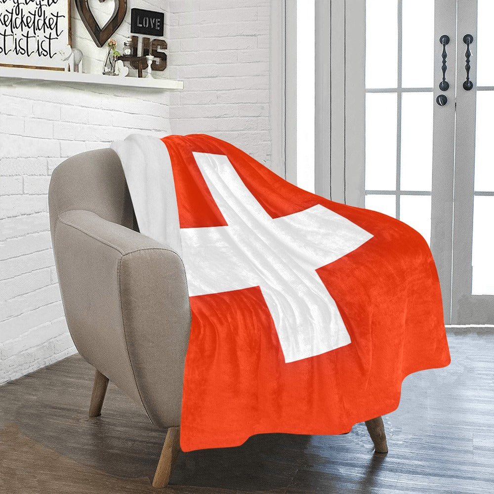 Red and white flag blanket on armchair by Luv My Flag.