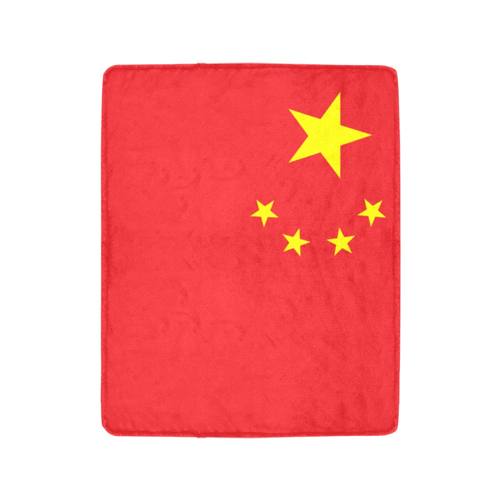 Red blanket with yellow stars, resembling Chinese flag. Luv My Flag.