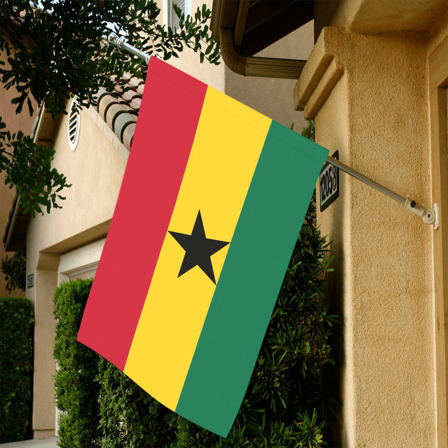 House with Ghana flag hung by Luv My Flag.