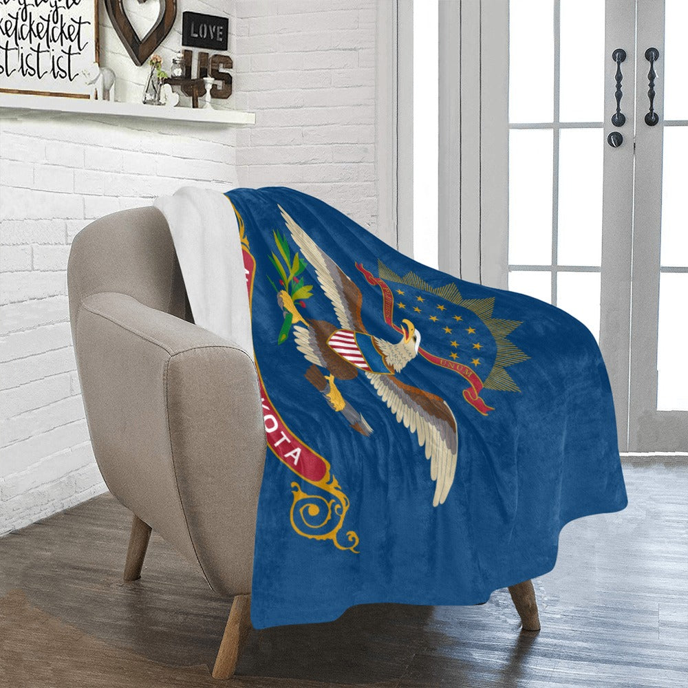 Blue Luv My Flag blanket with eagle design draped over chair.