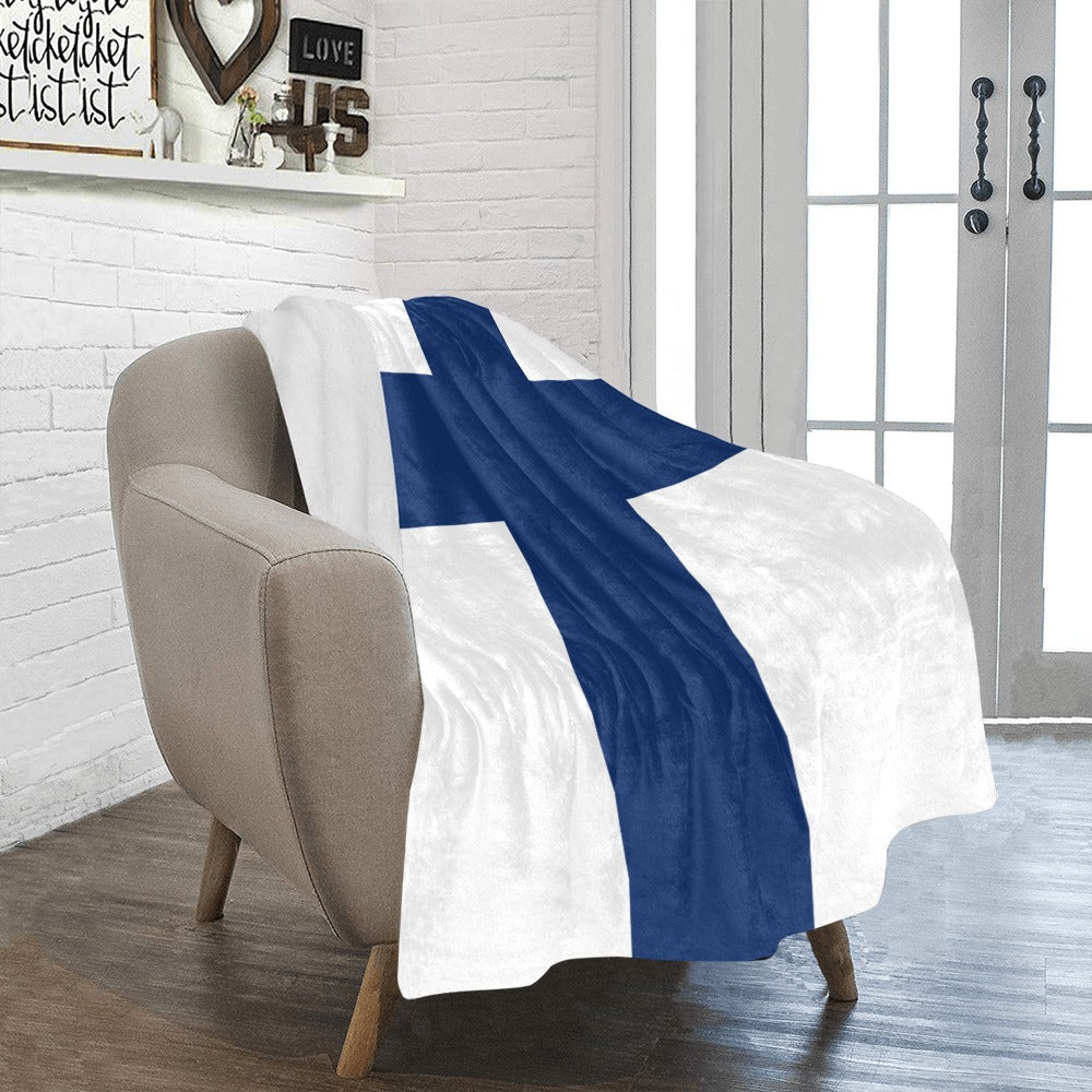 Cozy chair with Luv My Flag Finnish flag blanket.