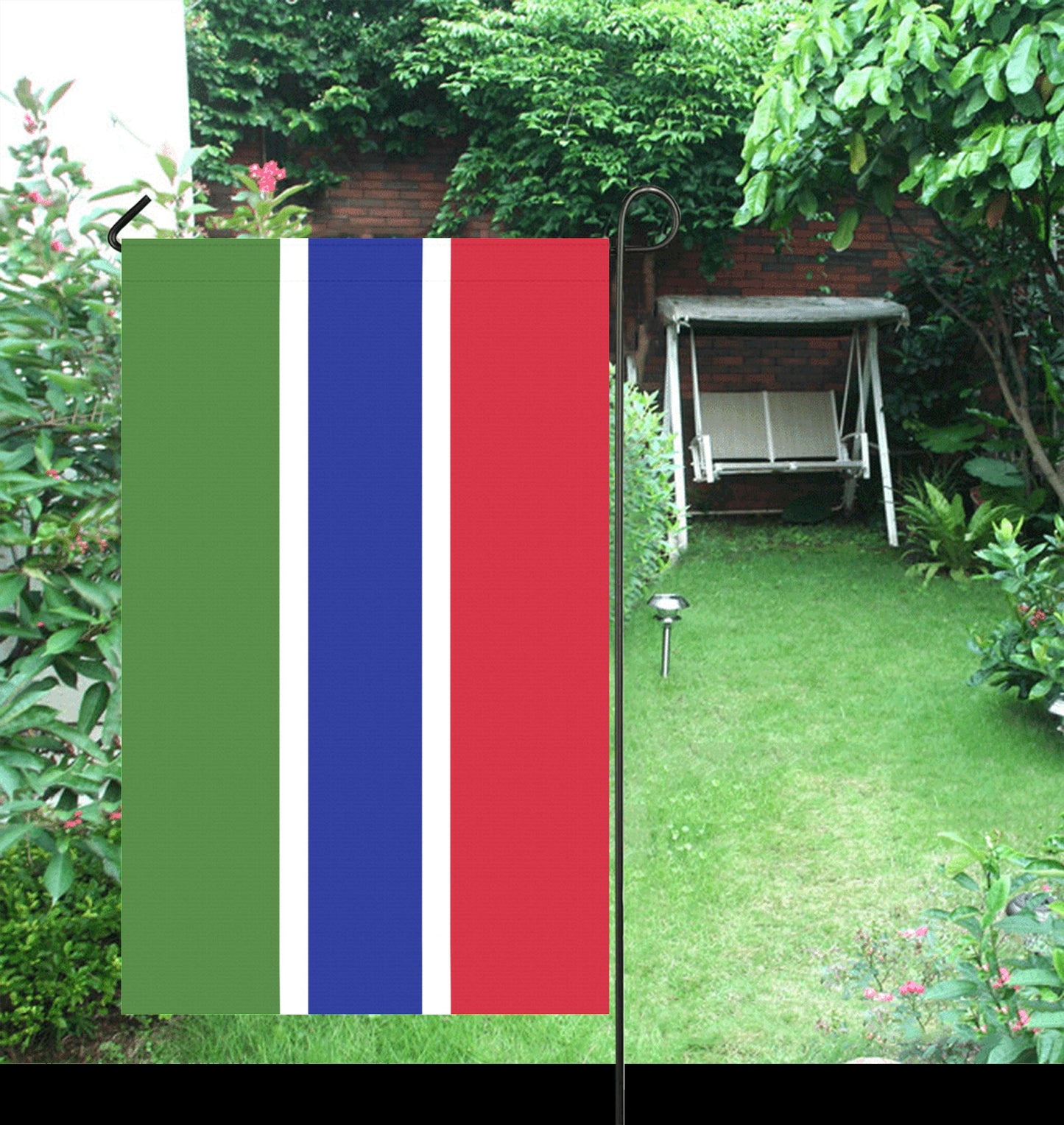Luv My Flag banner in garden with a swing.