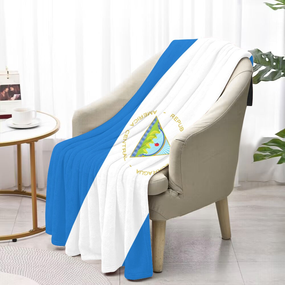 "Luv My Flag blanket draped over chair, featuring Nicaragua design."
