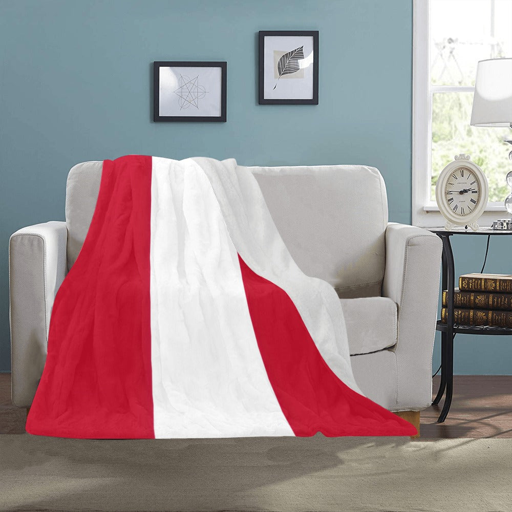 Cozy Luv My Flag blanket on a beige sofa.