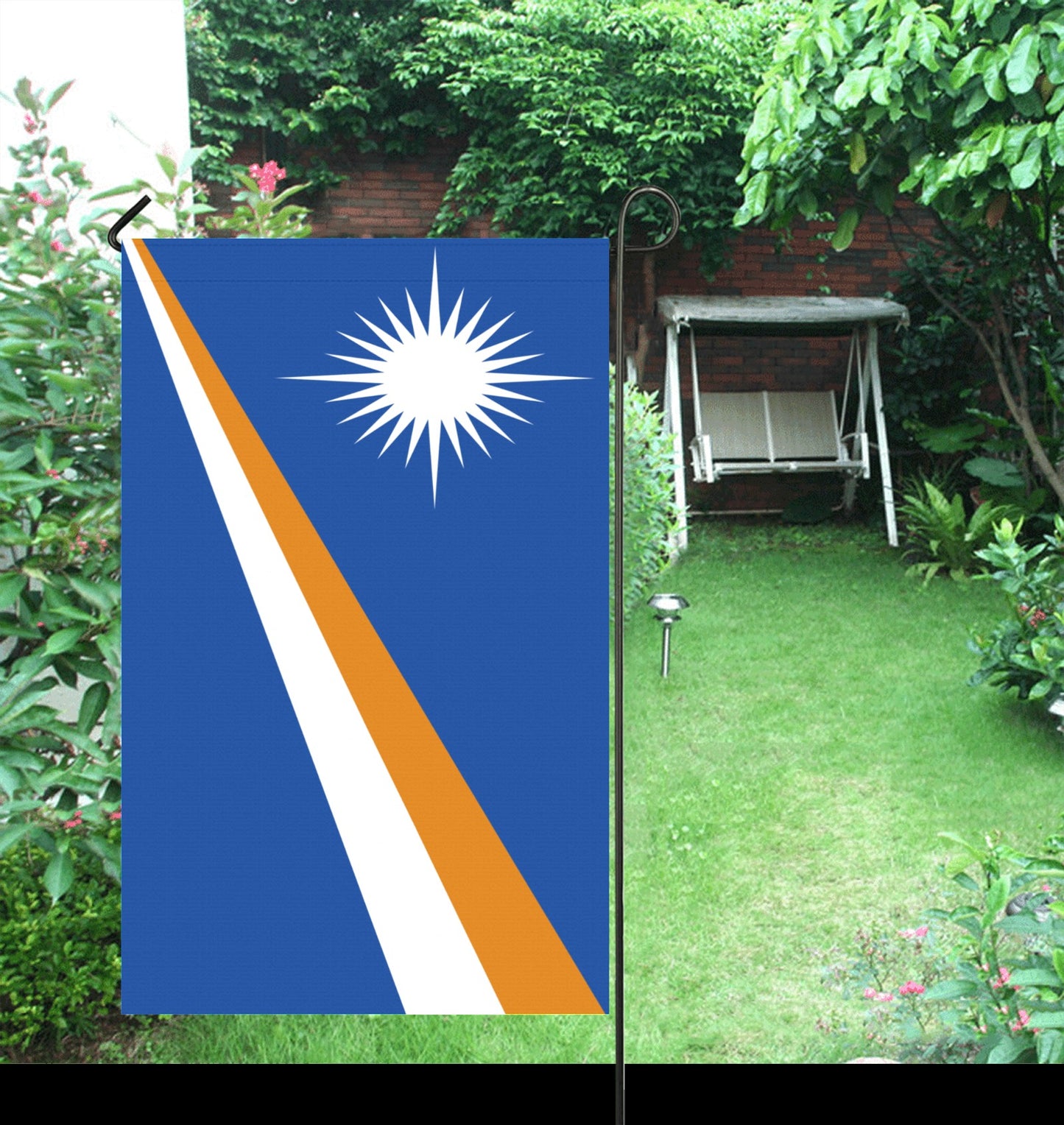 Flag by Luv My Flag in a lush garden.
