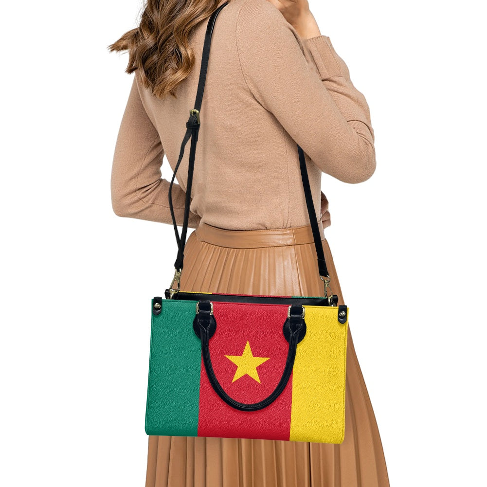 Woman carrying Luv My Flag handbag with flag design.