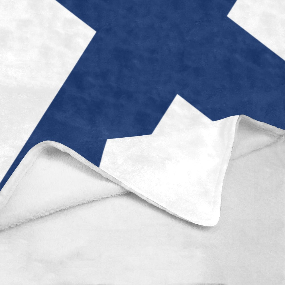 Folded white and blue blanket from Luv My Flag.
