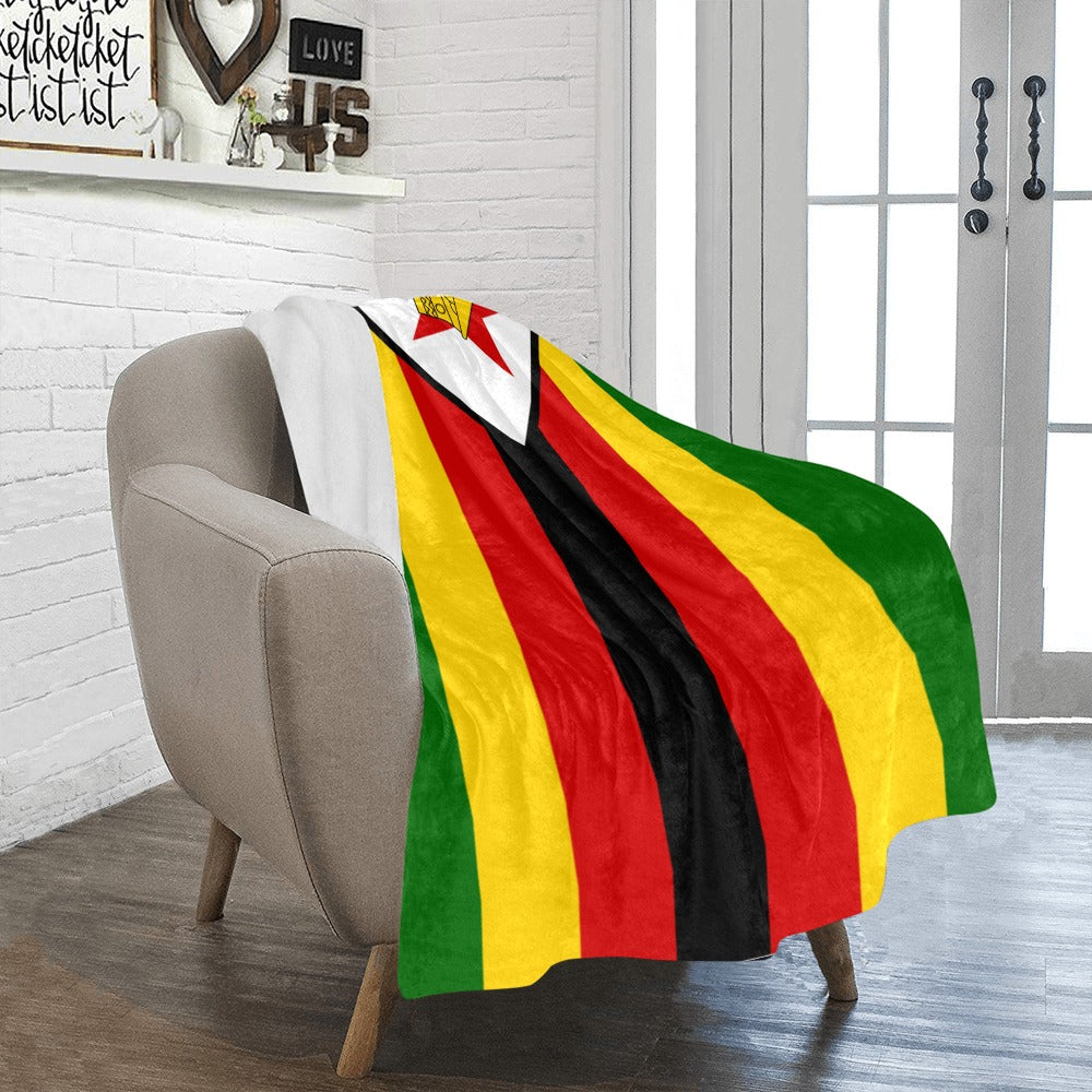 Cozy chair draped with Luv My Flag Zimbabwean blanket.