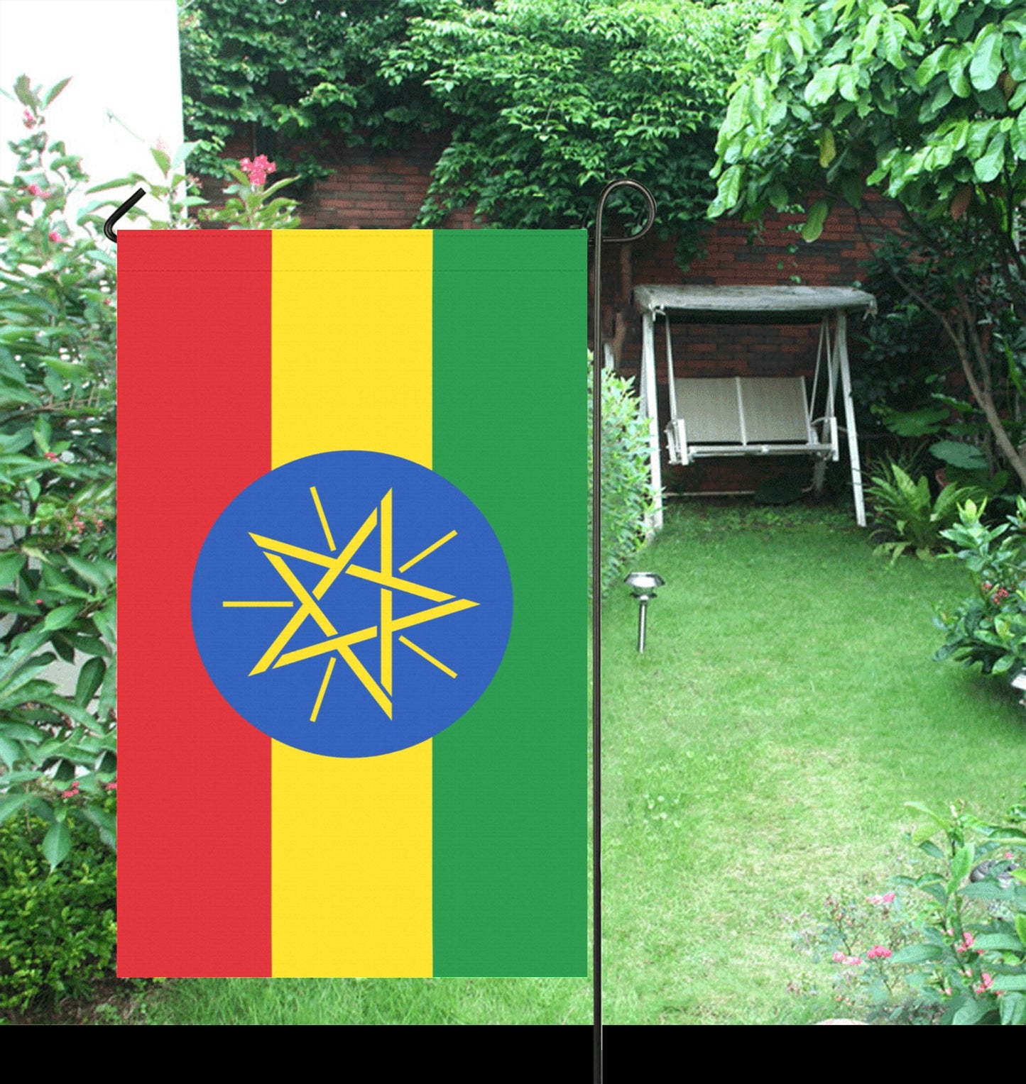 Luv My Flag garden decor with Ethiopian flag, lush background.