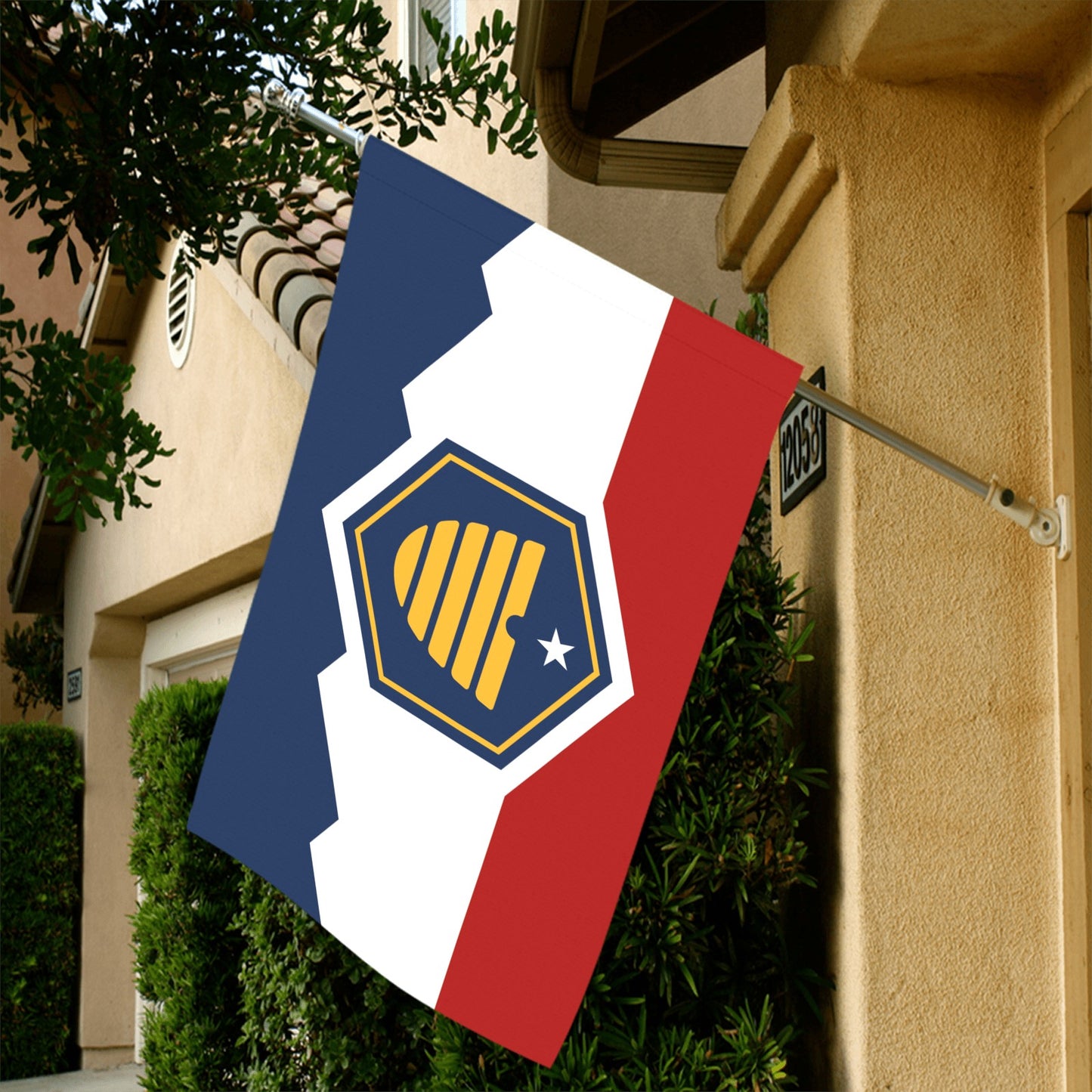 Luv My Flag waving outside a modern suburban home.