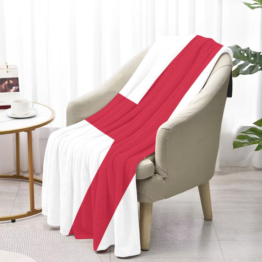 Luv My Flag blanket, red cross on white chair.