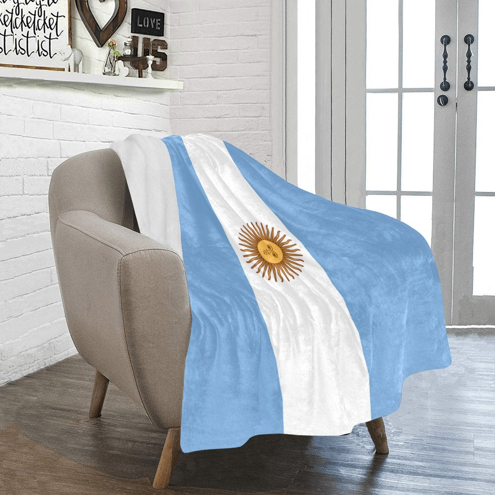 Cozy chair with Luv My Flag Argentina themed blanket.