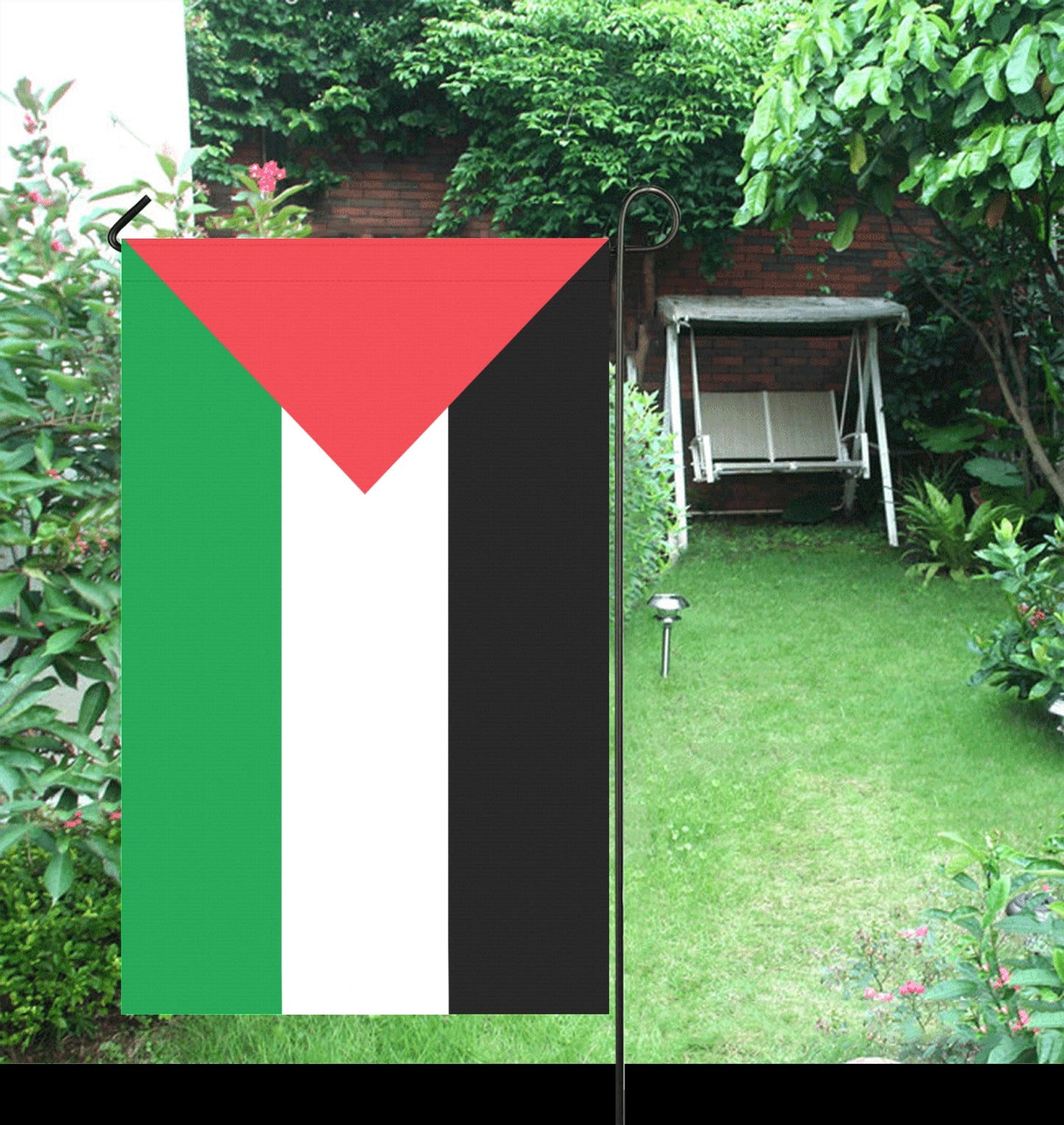 "Luv My Flag Palestinian flag decorates lush garden setting."