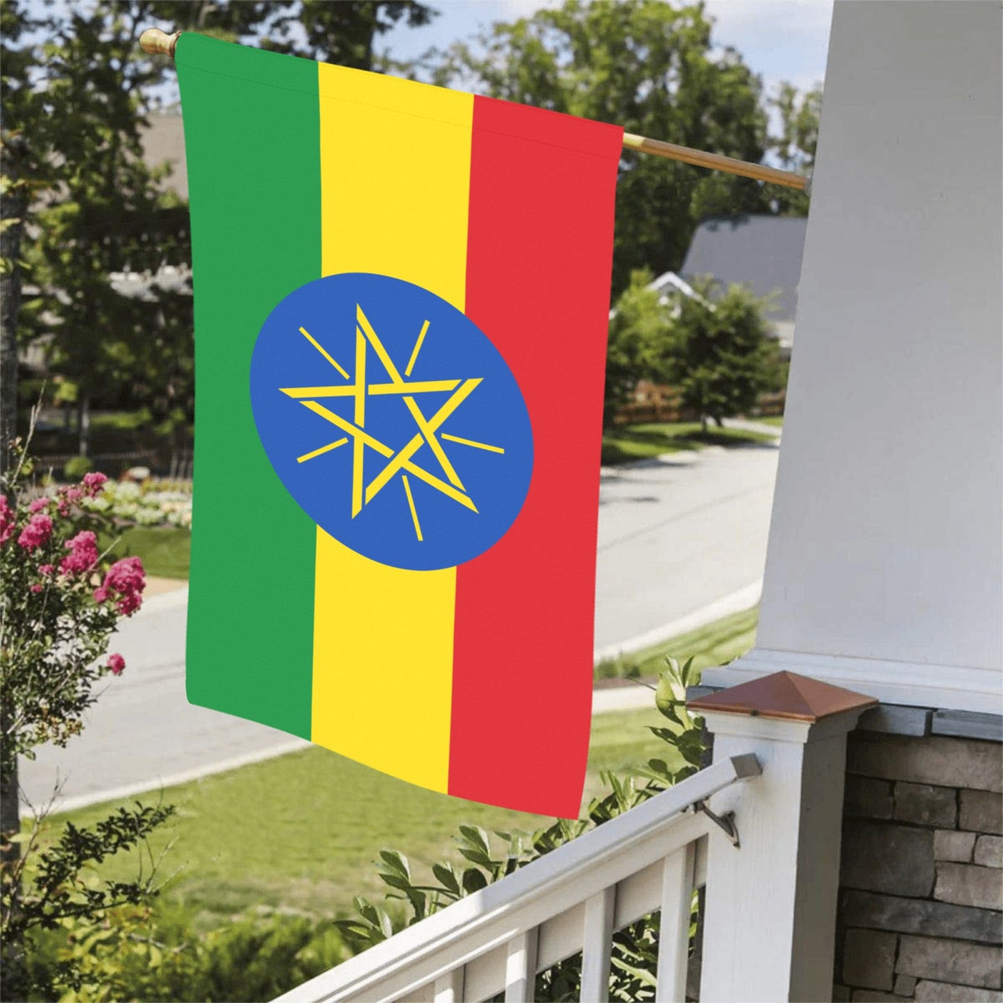 Luv My Flag Ethiopia banner hanging from suburban porch.