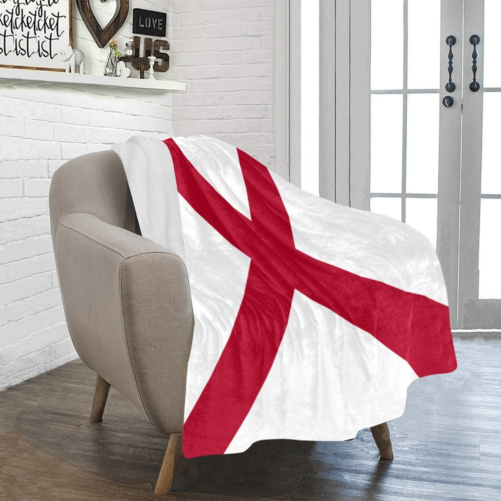 Armchair with Luv My Flag Alabama throw blanket draped.