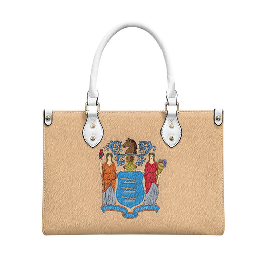 Tan handbag featuring state emblem, white handles, Luv My Flag.