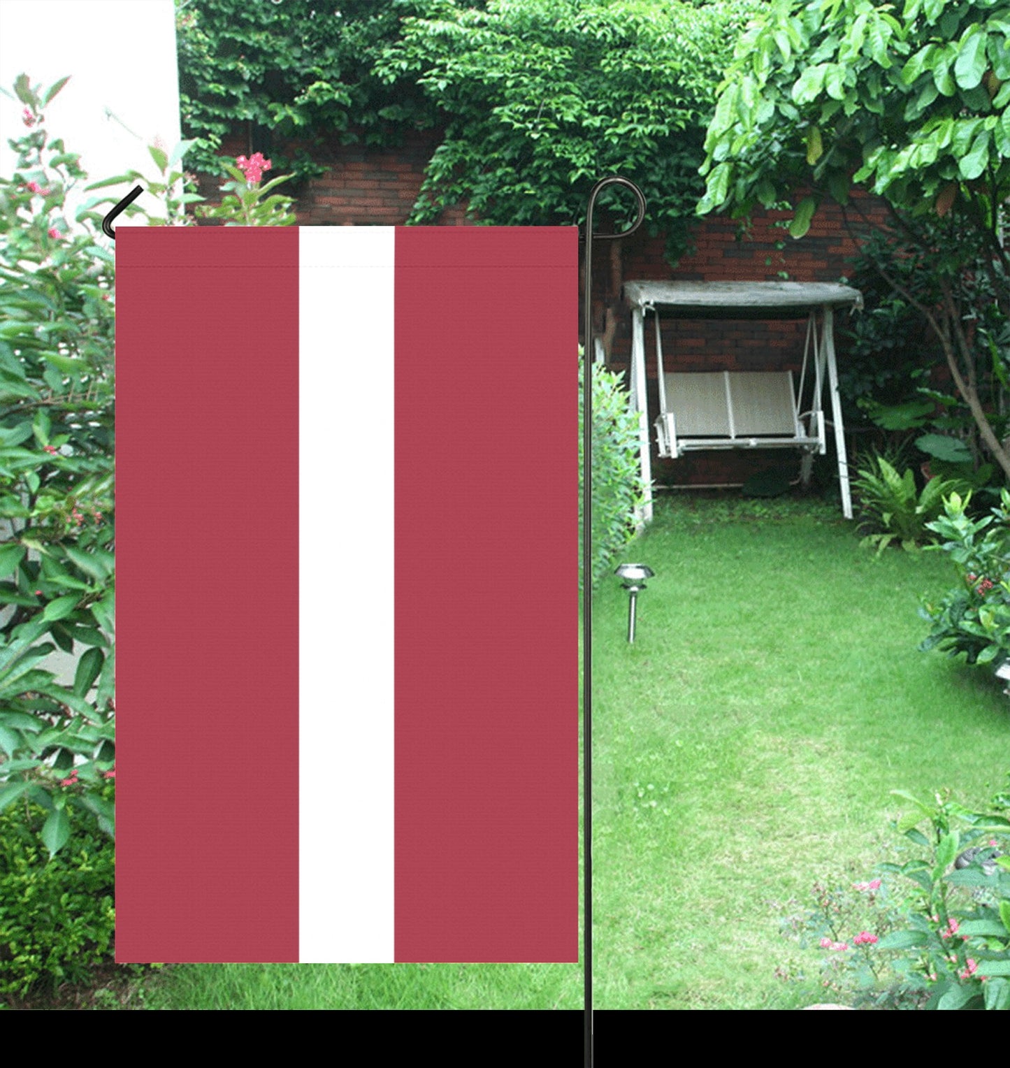 Luv My Flag: red flag with white stripe, garden background.