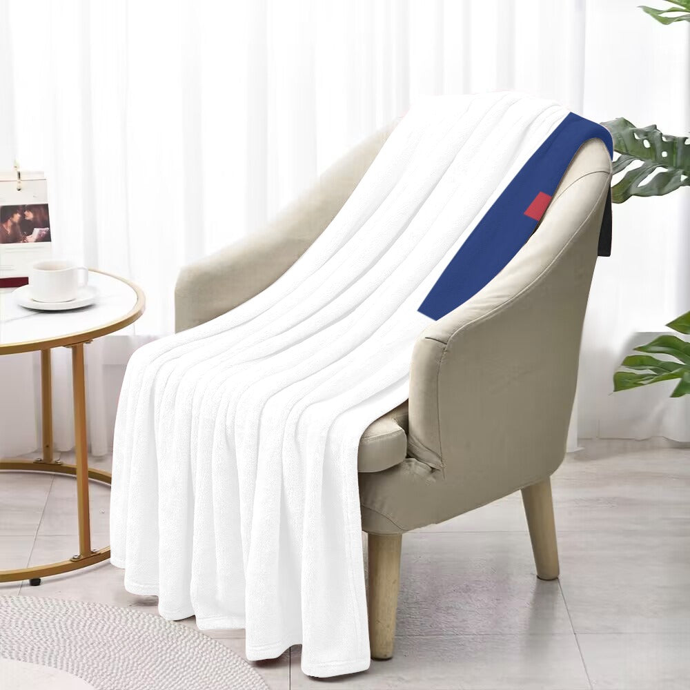 White blanket draped over chair, Luv My Flag brand.