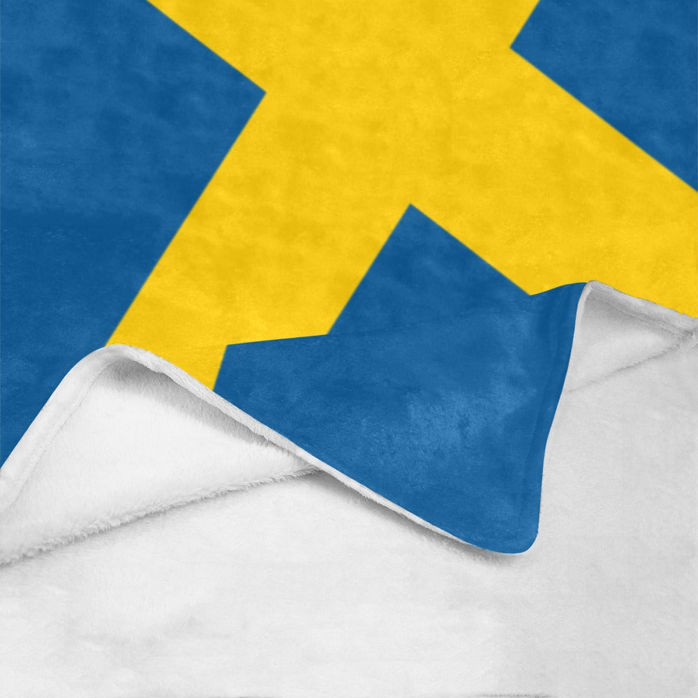 Luv My Flag blanket featuring blue and yellow geometric pattern.