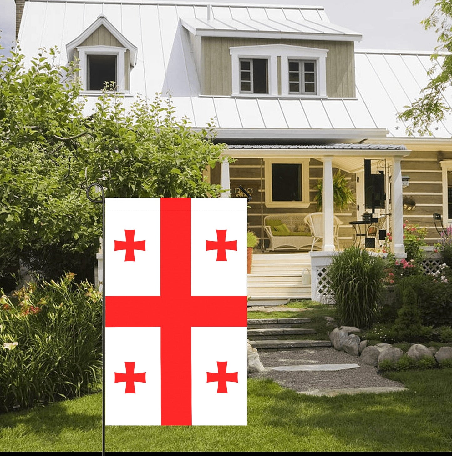White house surrounded by garden with Luv My Flag displayed.