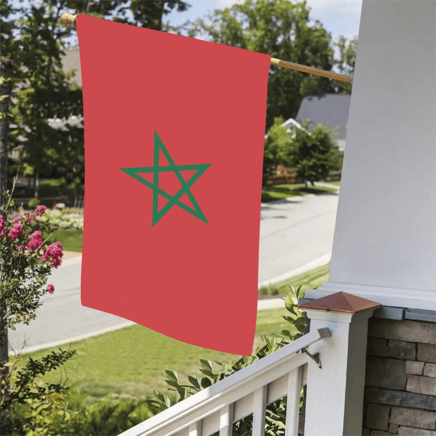 Red flag with green star on porch, Luv My Flag.