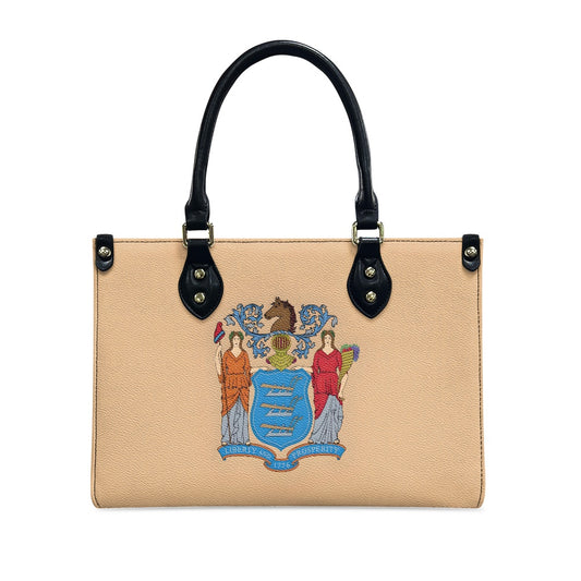 Beige handbag with New Jersey emblem, black handles, Luv My Flag.