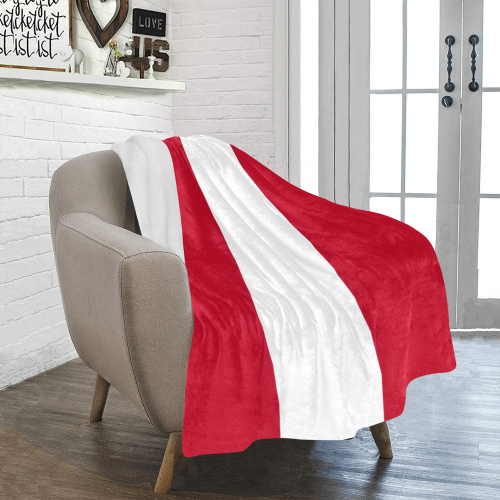 Cozy chair with Luv My Flag striped red blanket.