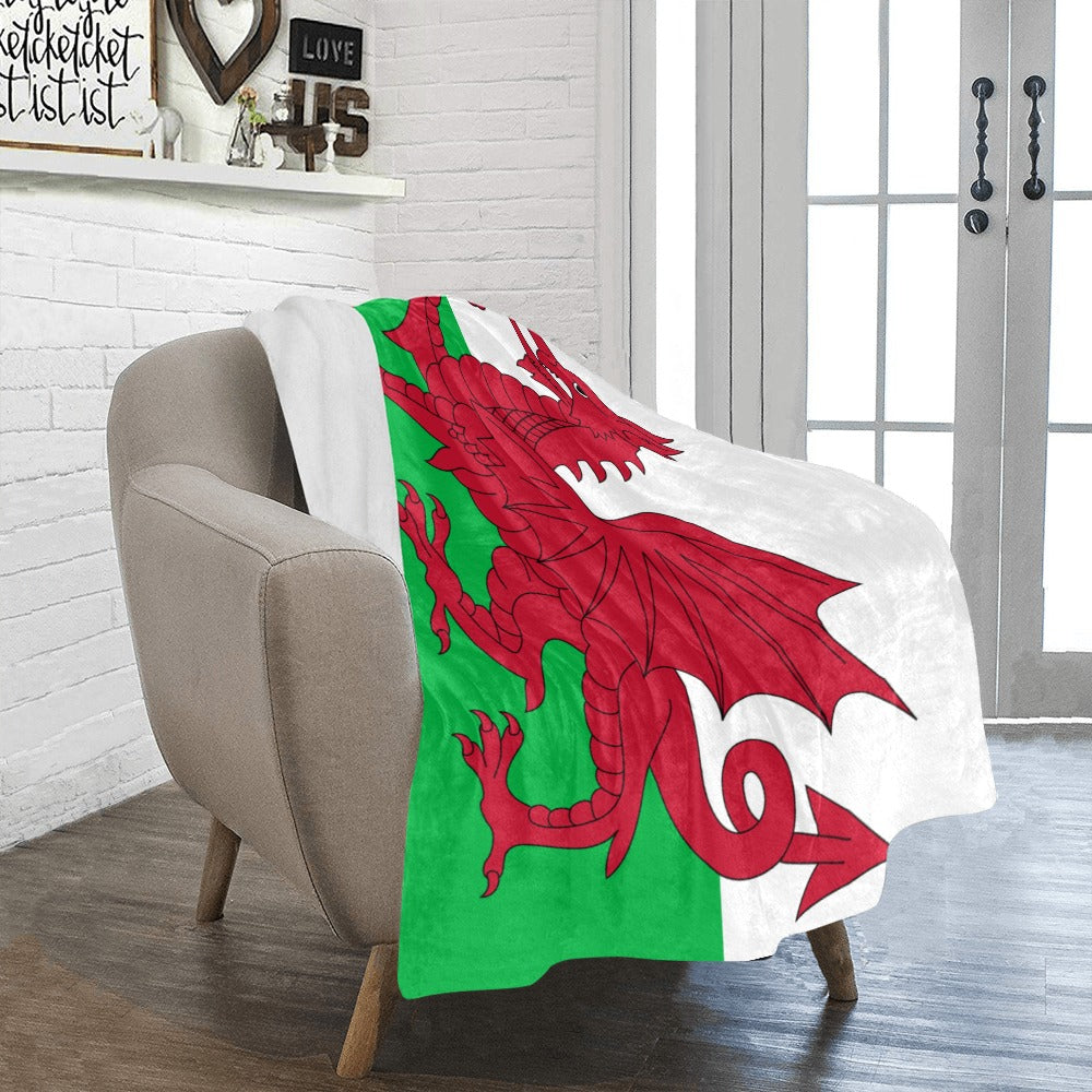 Cozy chair draped with Luv My Flag Welsh blanket.