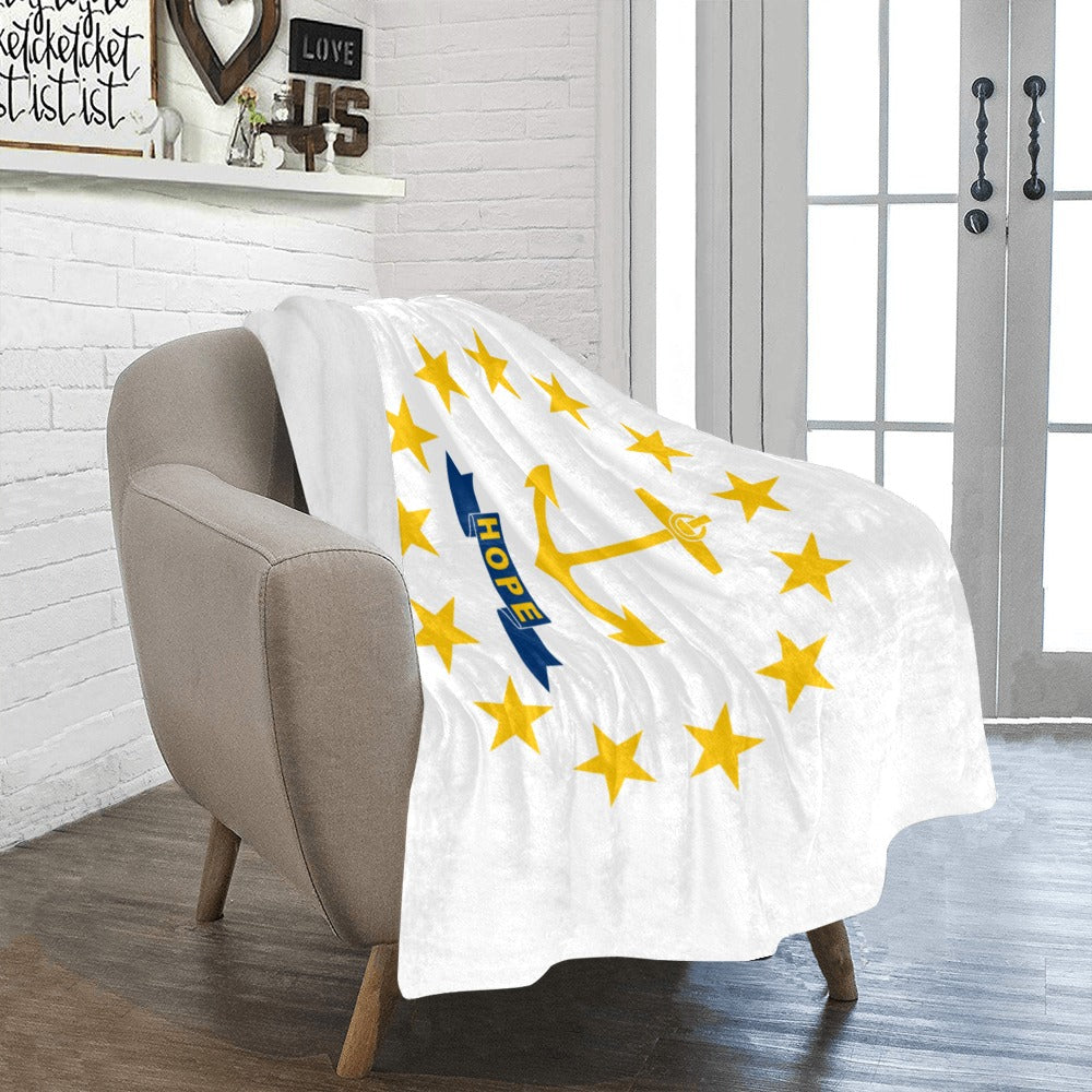 Cozy armchair with Luv My Flag fleece blanket draped.