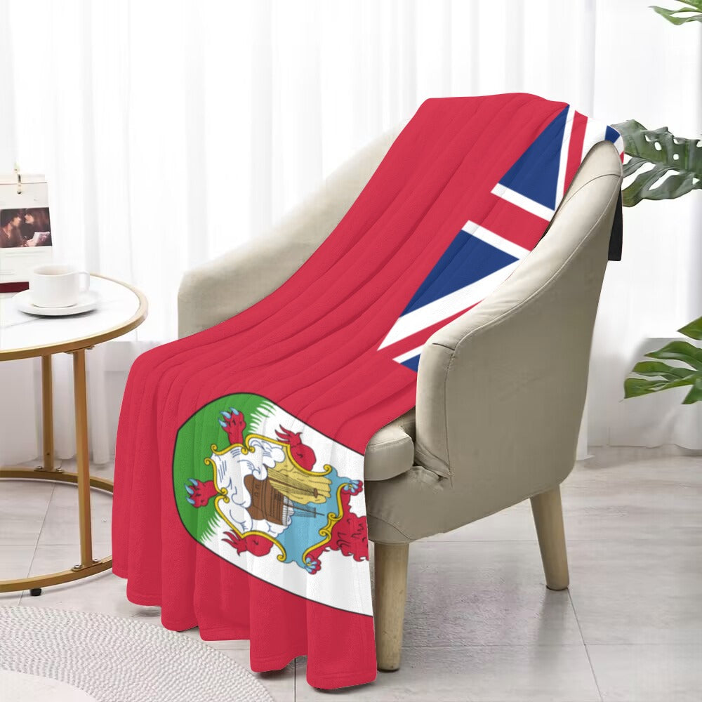 "Luv My Flag blanket featuring colorful flag design on chair."