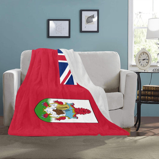 Cozy sofa with Luv My Flag Bermuda blanket displayed.