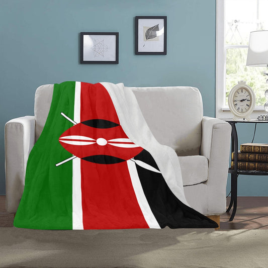 Luv My Flag blanket with Kenyan flag draped on sofa.