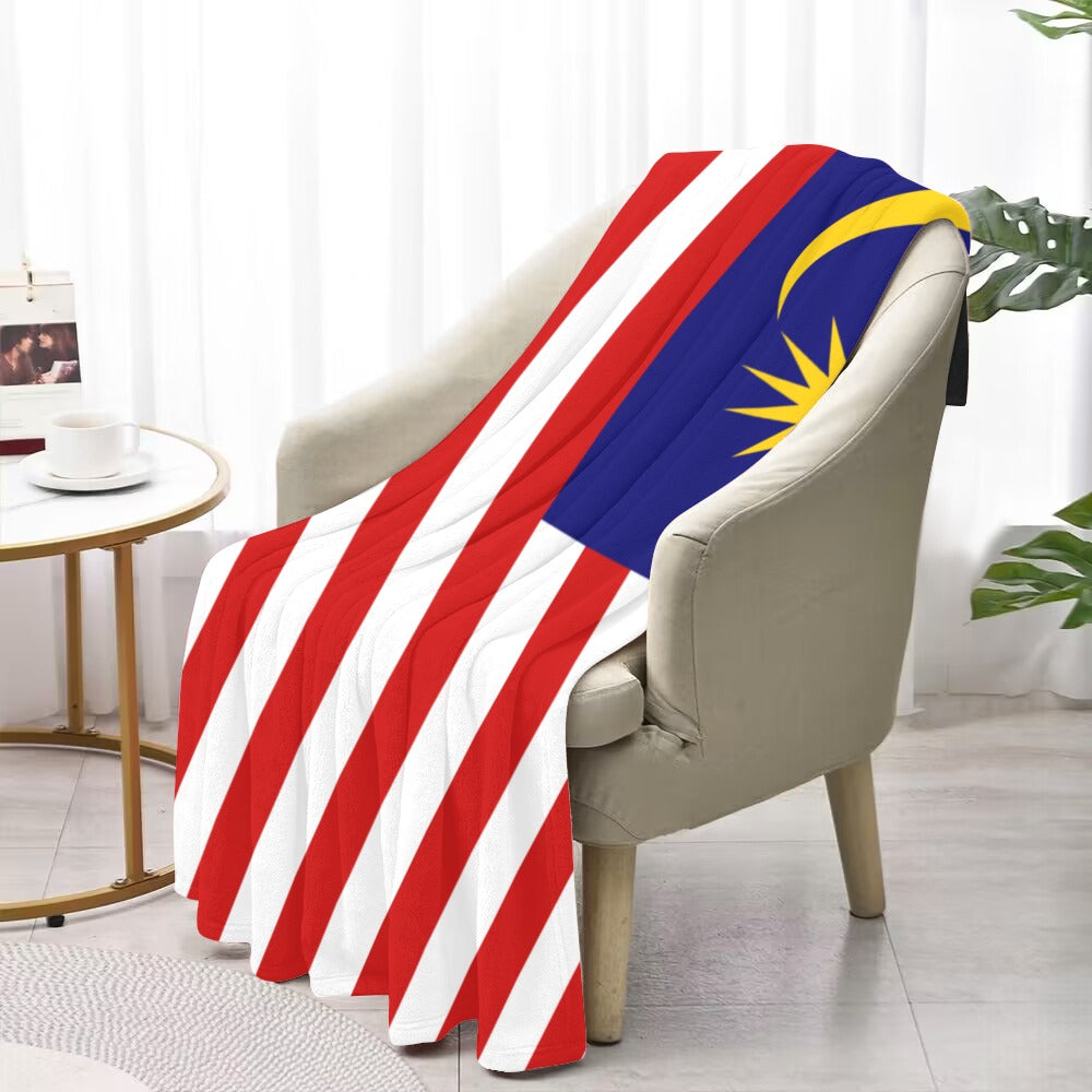 Luv My Flag blanket draped over chair, featuring Malaysian design.
