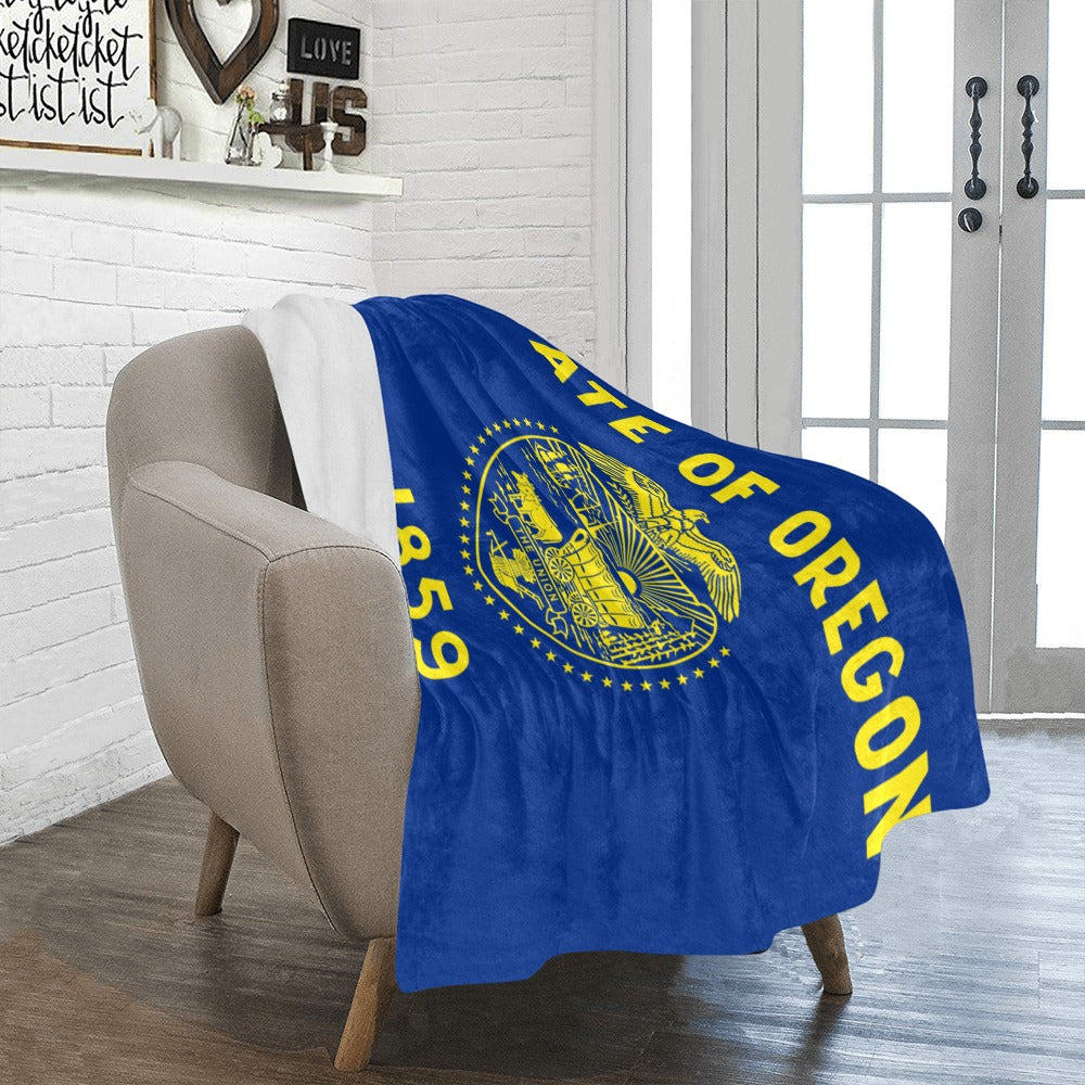 Cozy Oregon flag blanket by Luv My Flag on chair.