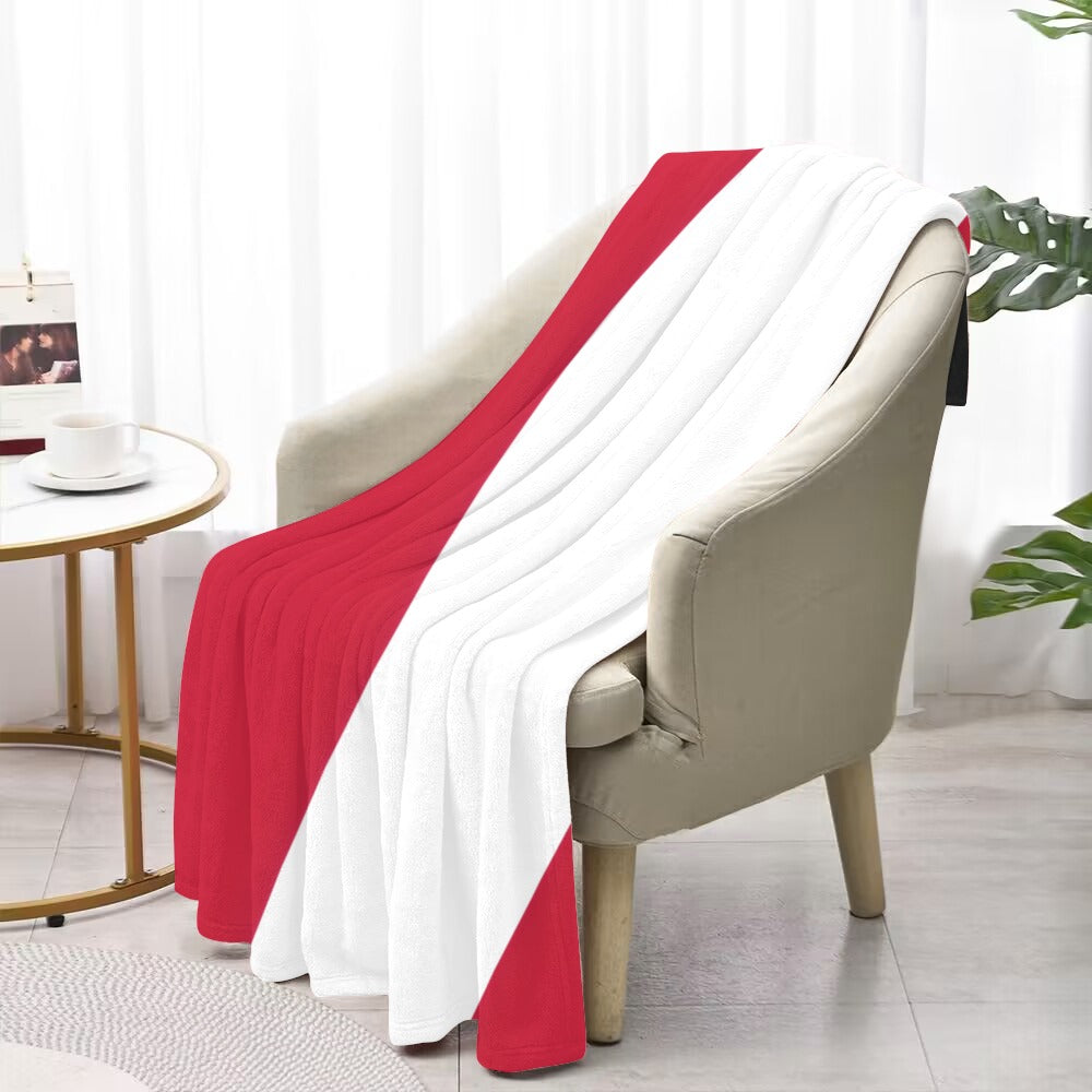 Luv My Flag blanket on chair, red and white design.