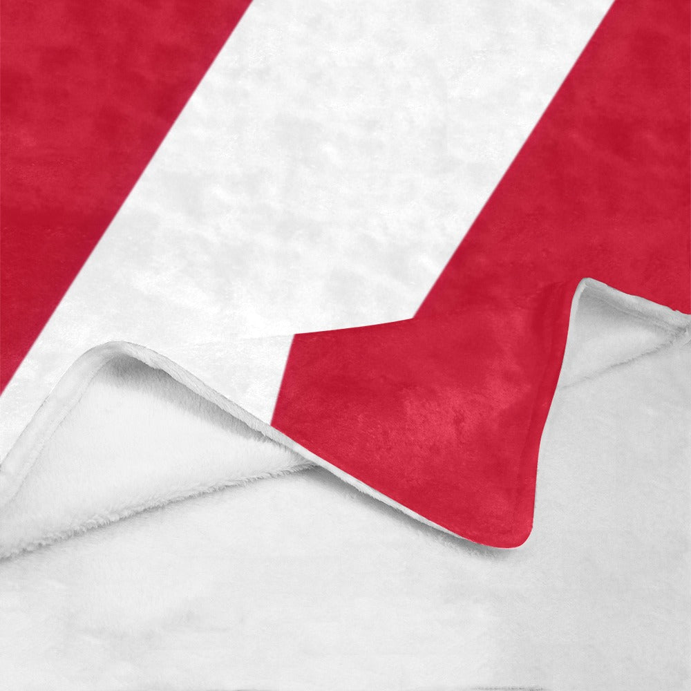 Red and white blanket corner by Luv My Flag brand.