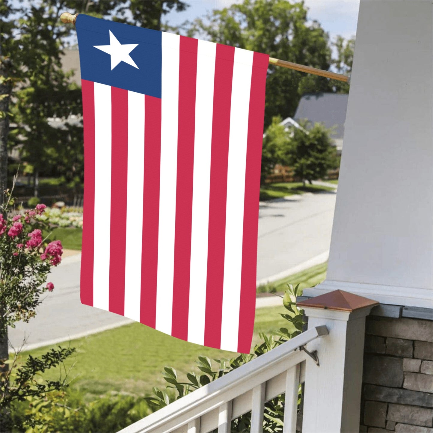 Luv My Flag displays Liberia flag on residential porch.
