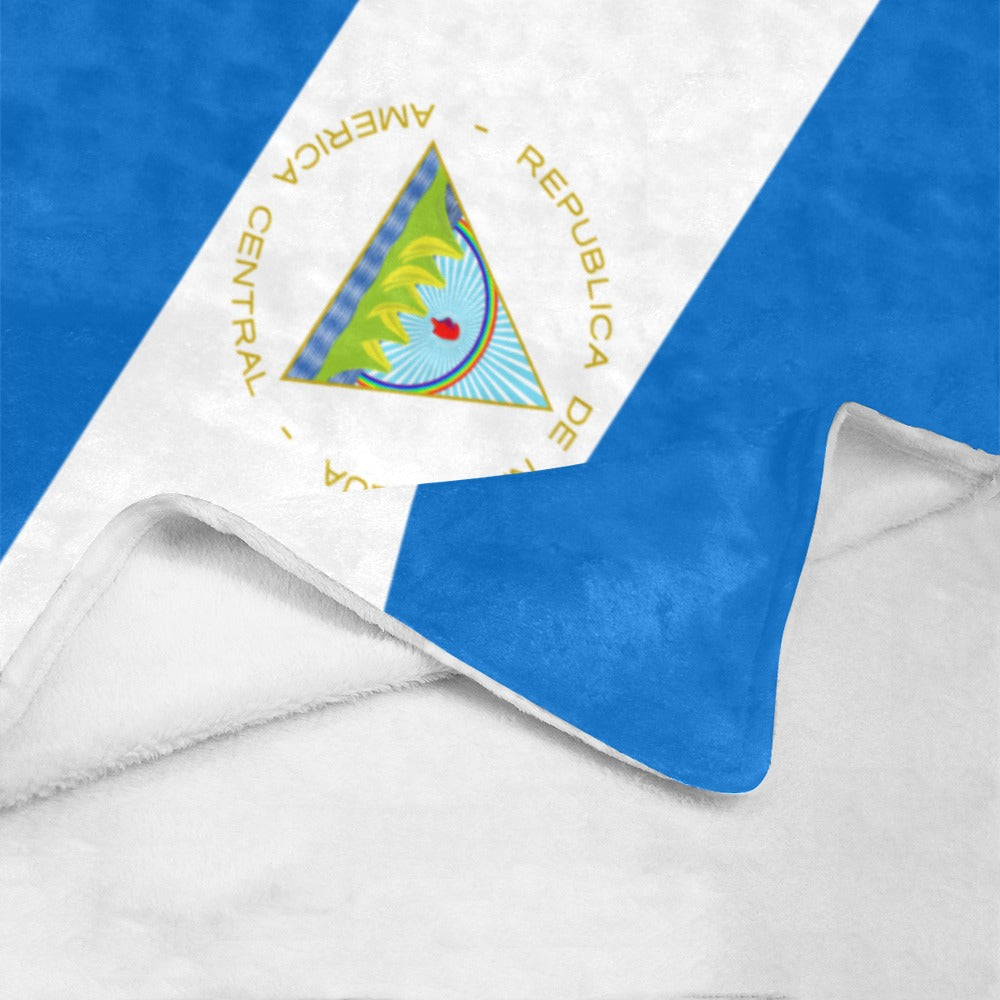Blue and white blanket featuring Nicaragua flag by Luv My Flag.