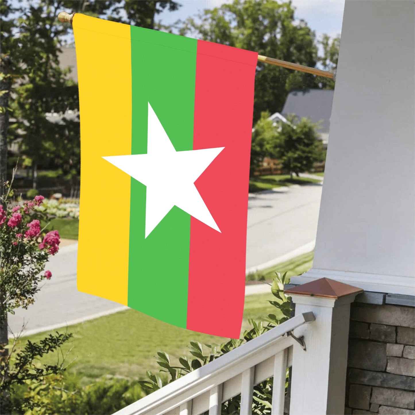 Colorful Luv My Flag displayed outdoors on a porch.