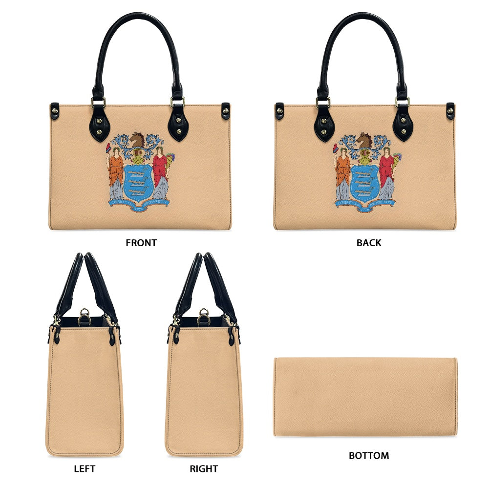 Luv My Flag beige handbag with detailed crest design.