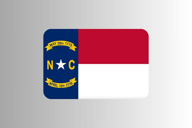 North Carolina state flag with a blue vertical stripe on the hoist side containing a white star and gold “N” and “C,” and two horizontal stripes in red and white, with gold banners displaying key historical dates.