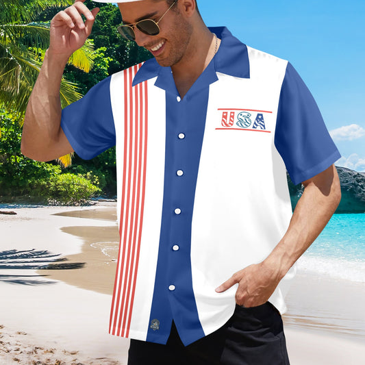 Man on beach wearing [Brand] USA-themed shirt, sunglasses, smiling.