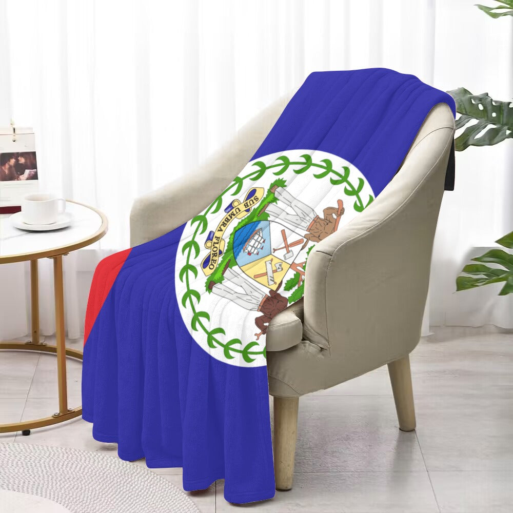 Cozy chair with Luv My Flag Belize blanket draped.