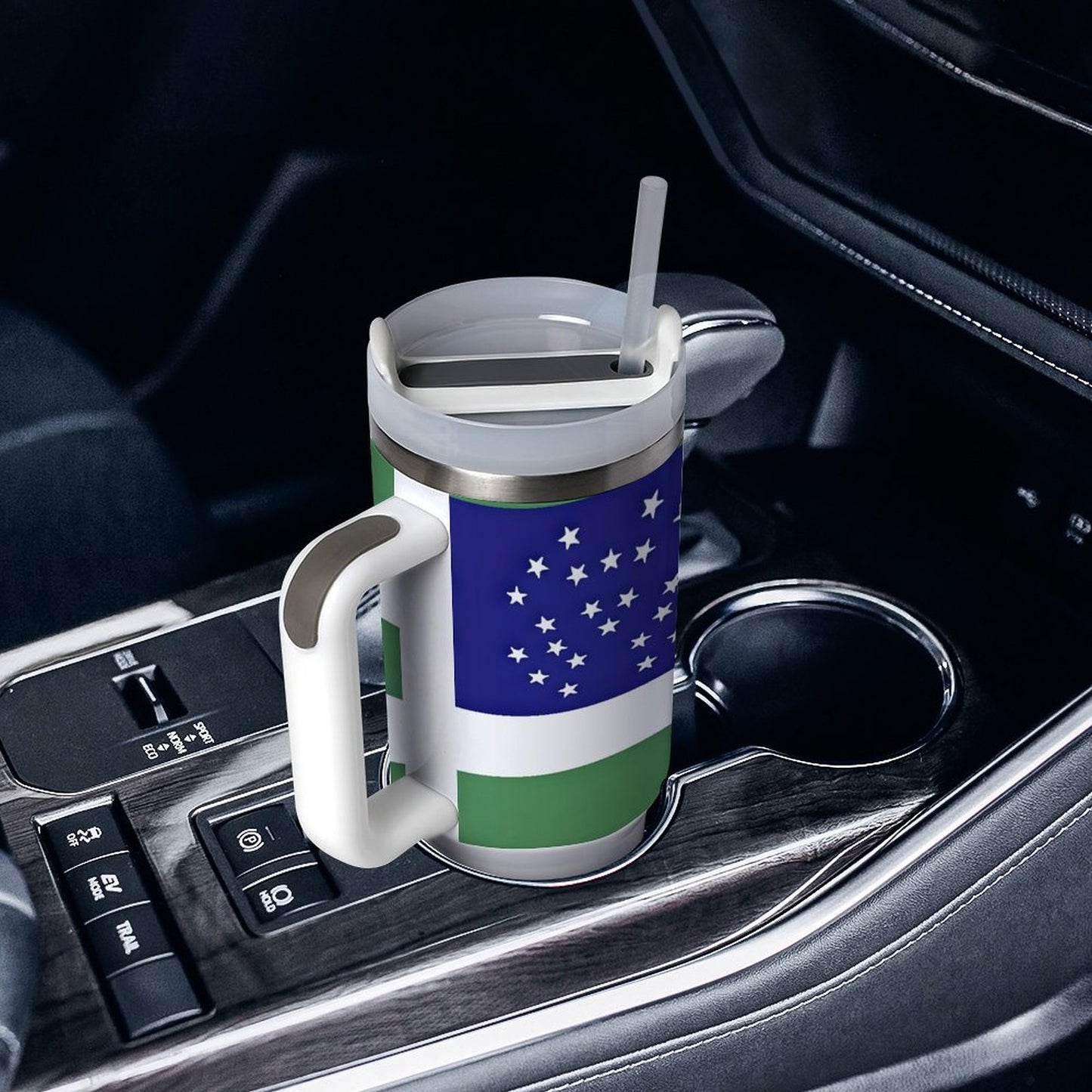 [Brand] mug with colorful design in car cup holder.