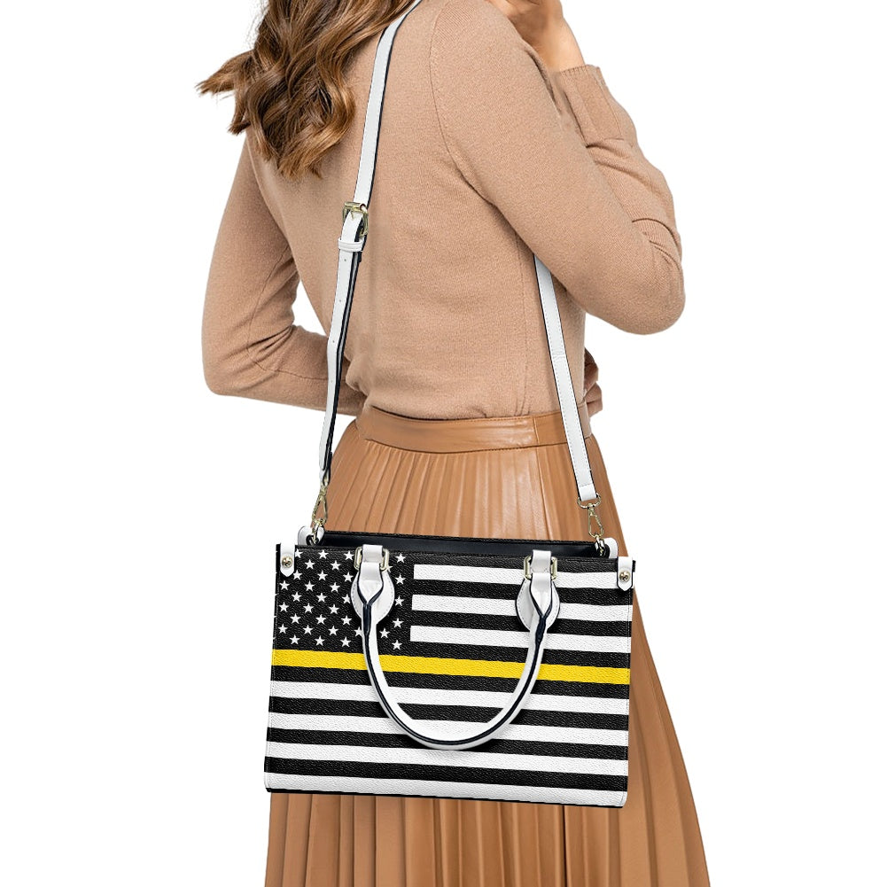 Young woman carrying [Brand] handbag with American flag design.