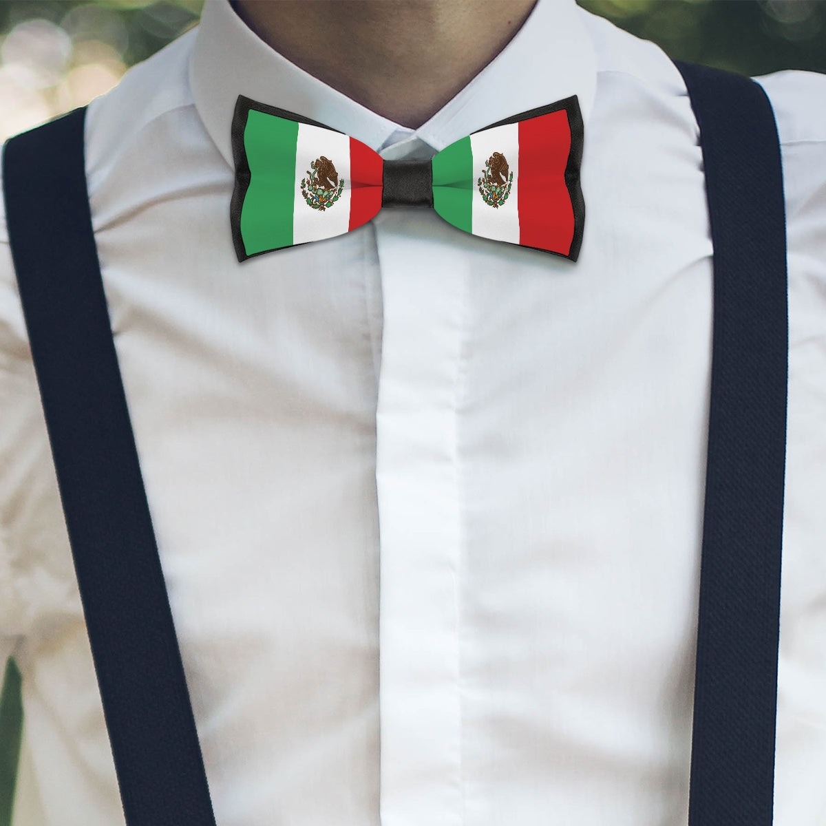 A person wearing [Brand] Mexican flag bowtie and suspenders.